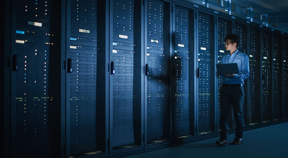 In,Dark,Data,Center:,Male,It,Specialist,Walks,Along,The